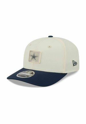 Beige and navy baseball cap with a navy star patch on front and New Era logo on side, featuring a curved brim and ventilation holes.
