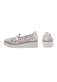 White slip-on shoes with a textured mesh upper, floral accents, and a chunky white sole. Features cut-out designs and scalloped edges.