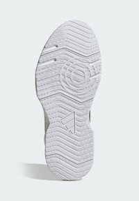 Witte rubberen schoenzool met gestructureerde gripstukken, inclusief zigzaggroeven en cirkelvormige accenten, voorzien van merkdetails.