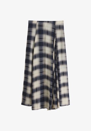 Tumesinine ja valge ruuduline midi seelik A-lõikega ja pehmete volangidega.