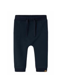 Shorts en coton bleu marine avec une taille élastique, deux poches latérales et un logo visible sur le bas de la jambe gauche.