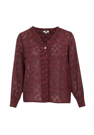 Blusa trasparente color bordeaux con maniche lunghe, scollo a V e un singolo bottone decorativo al centro. Motivo sottile su tutto il tessuto.