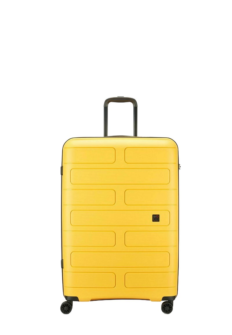 Maleta amarilla de concha dura con un diseño estriado, textura suave, doble rueda y un asa retráctil para facilitar la maniobrabilidad.