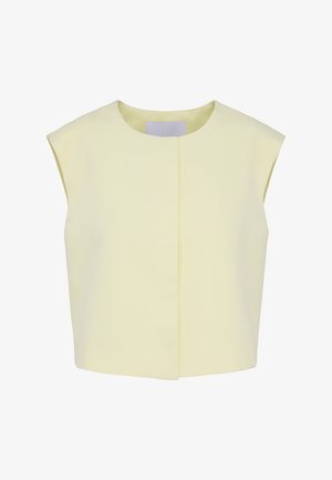 Vesta croptă galben pal, fără mâneci, cu decolteu rotund și închidere frontală ascunsă, expusă pe fundal alb.