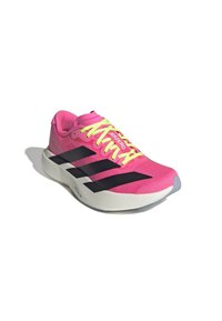 Pink athletic shoe with black stripes and neon yellow laces, featuring a lightweight design and textured upper material for breathability.