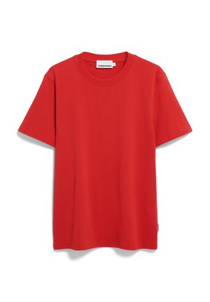 T-shirt rouge à manches courtes en coton. Encolure ronde, coupe droite et étiquette de marque discrète sur le côté. Texture lisse.