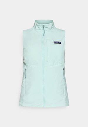 Light blue padded sleeveless vest with a high collar, centered zipper, and two zipped side pockets. Patagonia logo on the chest.