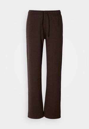 Brune afslappede joggingsbukser lavet af blødt stof, med elastisk talje og snor samt lige ben.