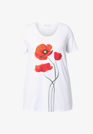 T-shirt blanc à manches courtes avec un graphisme de trois fleurs de pavot rouges avec des points noirs, affiché de manière proéminente au centre.