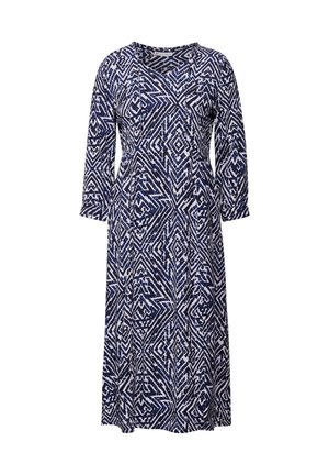 Abito stampato blu navy e bianco, caratterizzato da un motivo geometrico, maniche lunghe, scollo a V e una silhouette fluida.