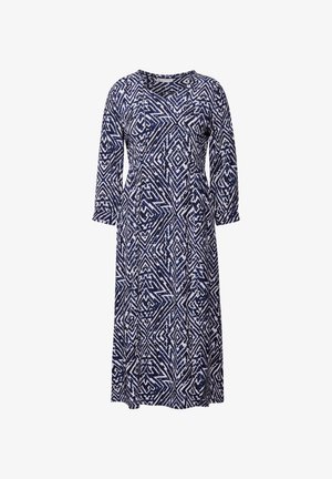 Šaty v námořnické modré a bílé barvě s potiskem, obsahující geometrický vzor, dlouhé rukávy, výstřih do V a volný siluetu.