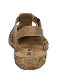 Sandale aus braunem Leder mit Ausschnitt-Design, verstellbaren Riemen, strukturieller Sohle mit floralen Mustern und gepolstertem Fußbett.