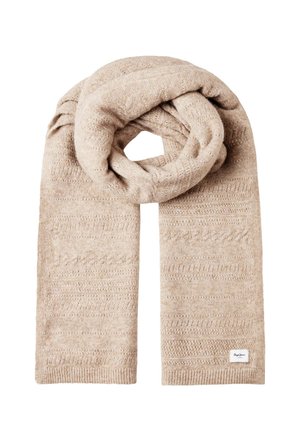 Sciarpa beige lavorata a maglia con motivi sottili e texture delicate, piegata con un'estremità passata creando un foro centrale, con una piccola etichetta in tessuto bianca attaccata.