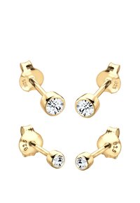 Orecchini a perno in tono oro con una finitura liscia, caratterizzati da cristalli tondi trasparenti incastonati in un semplice design a cornice. Marchiati "925" per argento sterling.