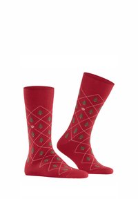Czerwone skarpetki bawełniane w diamentowy wzór, z zielonymi drzewami i białymi liniami. Długość do kostki z prążkowanymi ściągaczami. Miła w dotyku tekstura.