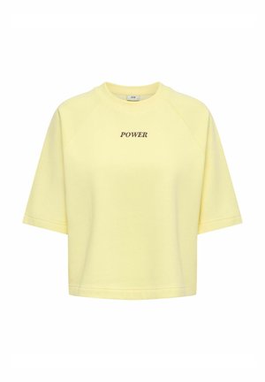 Sweatshirt court à manches courtes jaune clair avec "POWER" imprimé en noir sur la poitrine, doté d'un col rond.