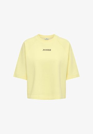Sweatshirt court à manches courtes jaune clair avec "POWER" imprimé en noir sur la poitrine, doté d'un col rond.