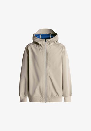 Chaqueta con capucha color beige de textura suave, cierre frontal con cremallera, forro azul y puños elásticos. Diseño sencillo, adecuada para uso casual.