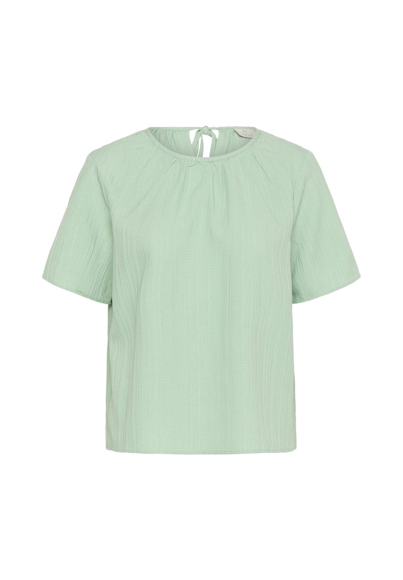 Blouse vert clair à manches courtes avec encolure ronde et détail de nouage au dos, en tissu texturé.
