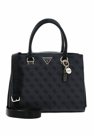 Black Guess handbag with monogram pattern, dual handles, adjustable shoulder strap, and metal logo tags on front center.
