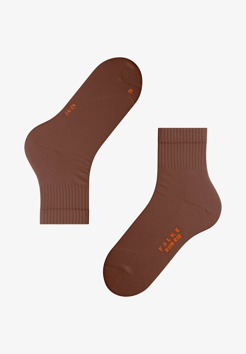 Brązowe skarpetki za kostkę wykonane z gładkiego materiału z prążkowanym wykończeniem. Posiadają pomarańczowe logo oraz szczegóły rozmiaru na górnej stronie.