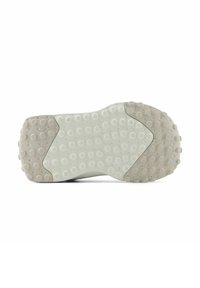 White shoe sole with textured circular patterns, featuring a smooth central section and a slightly raised edge, contrasting light gray accents.