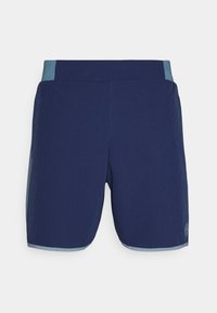Marineblaue Sportshorts mit einem hellblauen Bund. Hergestellt aus einem glatten, leichten Material. Verfügt über ein kleines Logo auf der unteren Seite.