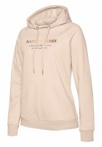 Sudadera beige con capucha y un bolsillo frontal, con el texto "NATURE VIBES" en marrón oscuro. Tejido suave y puños acanalados para mayor comodidad.