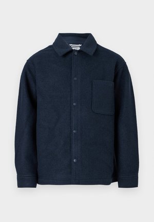 Navy blue wool button-up jacket with long sleeves, a pointed collar, and a large chest pocket on the left side.