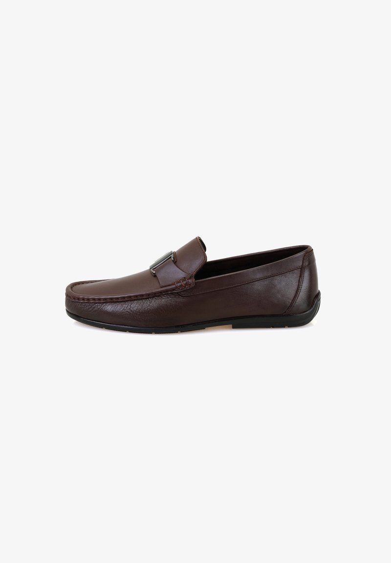 Brown leather loafers with a smooth texture, stitched detailing along the edge, and a decorative strap across the upper. Rubber sole.