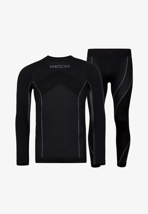Black thermal long-sleeve top and leggings, featuring textured panels and white stitching details, designed for active wear with a fitted shape.