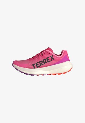 Pink athletic shoe with "TERREX" branding, lightweight mesh upper, cushioned white midsole, and multi-colored rubber outsole with traction.