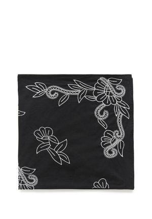 Black fabric square with white floral embroidery featuring flowers, leaves, and swirling vine patterns along the edges and center.