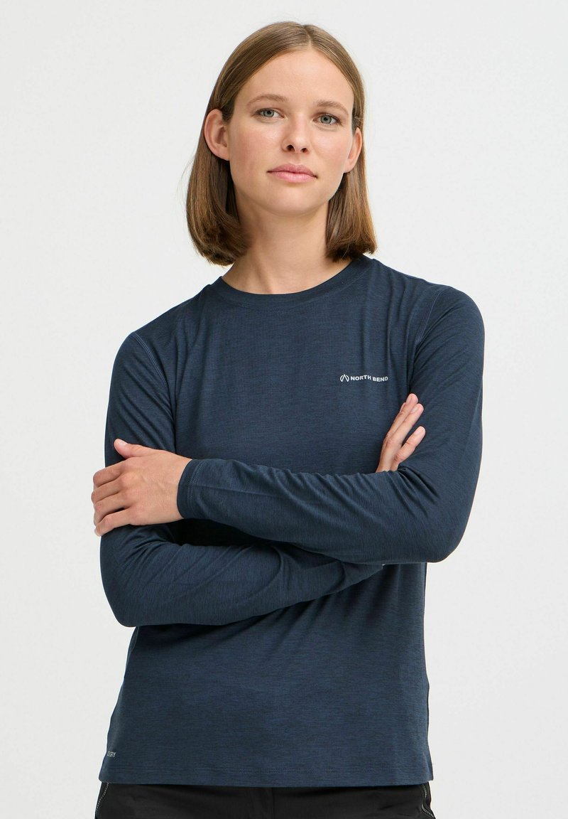Marineblaues Langarmshirt aus strukturiertem Stoff, mit Rundhalsausschnitt, schmaler Passform und kleinem Logo auf der linken Brustseite.