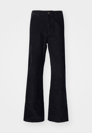 Black, cotton flared pants with a traditional waistband, single front button, and pockets at the sides and back. Smooth texture.