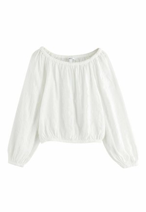 White long-sleeve off-shoulder blouse with elasticized neckline, cuffs, and hem, made of lightweight textured fabric.