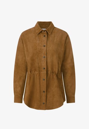 Brūns zamšādas krekls ar apkakli, pogām priekšpusē un elastīgu jostas detaļu. Garas piedurknes ar pogām pie aprocēm. Gluda tekstūra, regulārs piegrieziens.