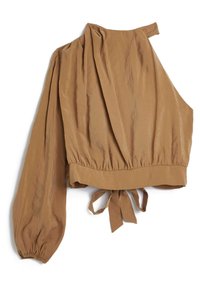 Brun asymmetrisk blus med en lång ärm och knytning i midjan, tillverkad av ett lätt tyg med en något rynkad textur.