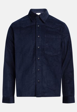 Donkerblauwe corduroy overhemd met een puntige kraag, lange mouwen, borstzak, knoopsluiting aan de voorkant en ribbelstructuur.