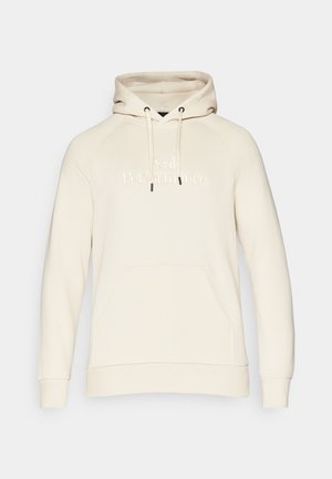 Beige pullover hoodie med snørehætte, kængurulomme og præget "Peak Performance" logo på fronten. Blød stoftekstur.