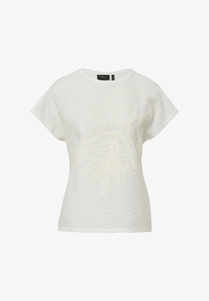 T-shirt blanc à manches courtes en tissu texturé, avec un motif de feuille brodé beige clair sur le devant. Encolure ronde.