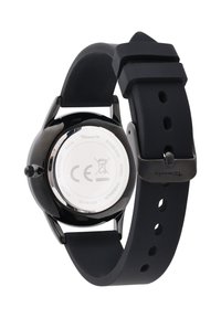 Black wristwatch with a stainless steel back. Features a smooth black silicone strap with a pin buckle and multiple adjustment holes.