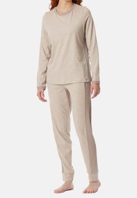 Beige long-sleeve top and matching pants made of soft fabric. Pants have ribbed side panels and cuffed hems. Smooth texture throughout.