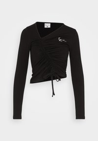 Sort langærmet top med V-hals og samlet detaljering foran. Har justerbare snore i kanten og et hvidt logo.