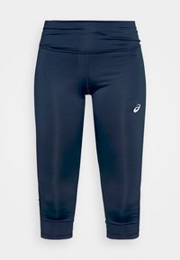 Leggings accorciati color navy realizzati in tessuto elasticizzato, con una superficie liscia e una vita elasticizzata. Logo sul lato inferiore destro.
