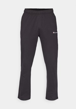 Black sweatpants with an elastic waistband, featuring a small white logo on the left thigh and a straight leg design. Soft cotton blend material.