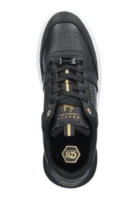 Black leather sneaker with perforated toe, gold accents, white sole, and black laces. Features signature logo and textured detailing on side.