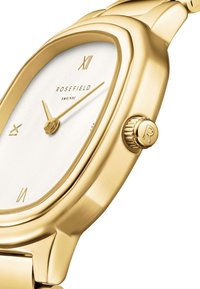 Reloj de tono dorado con caja rectangular, esfera blanca y agujas doradas. Presenta el texto "ROSEFIELD" y una corona intrincada con el detalle "R".