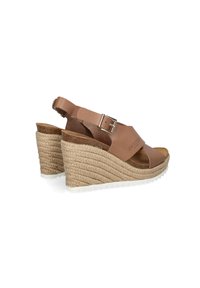 Tan leather wedge sandals with a textured rope heel, adjustable buckle strap, and soft footbed, featuring a white rubber outsole.