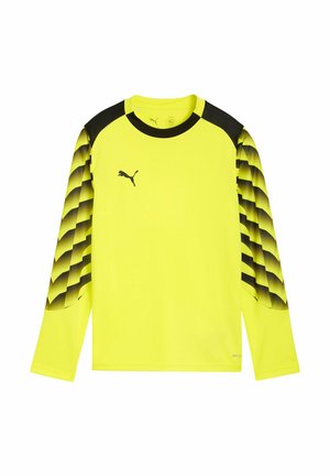 Camiseta deportiva de manga larga de color amarillo brillante con mangas con patrón degradado negro y logo negro de Puma en el pecho sobre fondo blanco.